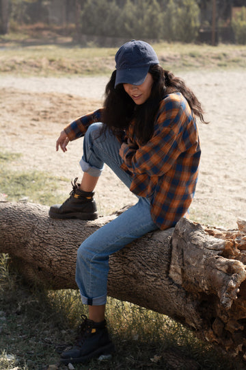 plus size woman in a flannel plaid shirt styled for fall