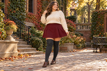 Plus size burgundy mini skirt with charcoal thigh high socks and loafers for fall