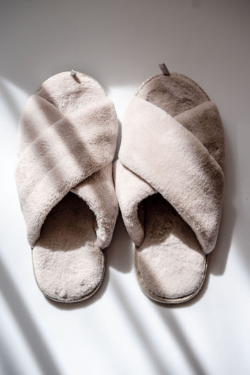 A pair of fluffy wide-fit slippers ready for cozy at-home wear