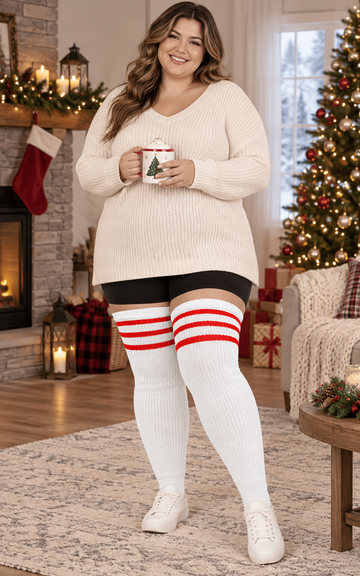 White & Red plus size striped thigh high socks, wide cuff and rib-knit texture, full-body indoor model photo, seasonal holiday scene