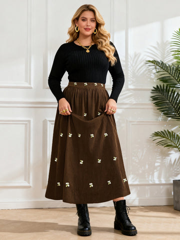 Brown midi skirt with allover small floral embroidery and wide gathered hem