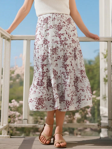 Tiered midi skirt in white with burgundy floral pattern and gathered tiers