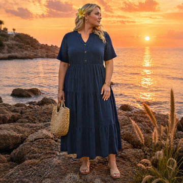 Navy maxi dress with V-neck button front, tiered layers, and short sleeves