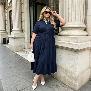 Navy short-sleeve maxi dress with V-neck, button front, and tiered skirt