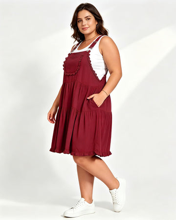 Burgundy lace-trim mini overall dress with tiered skirt and adjustable straps