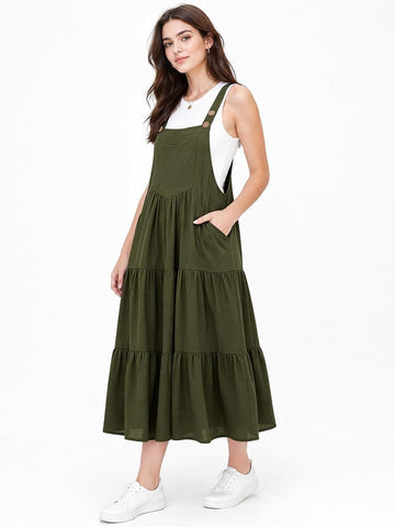 Olive tiered midi overall dress on model, wide straps and gathered skirt tiers