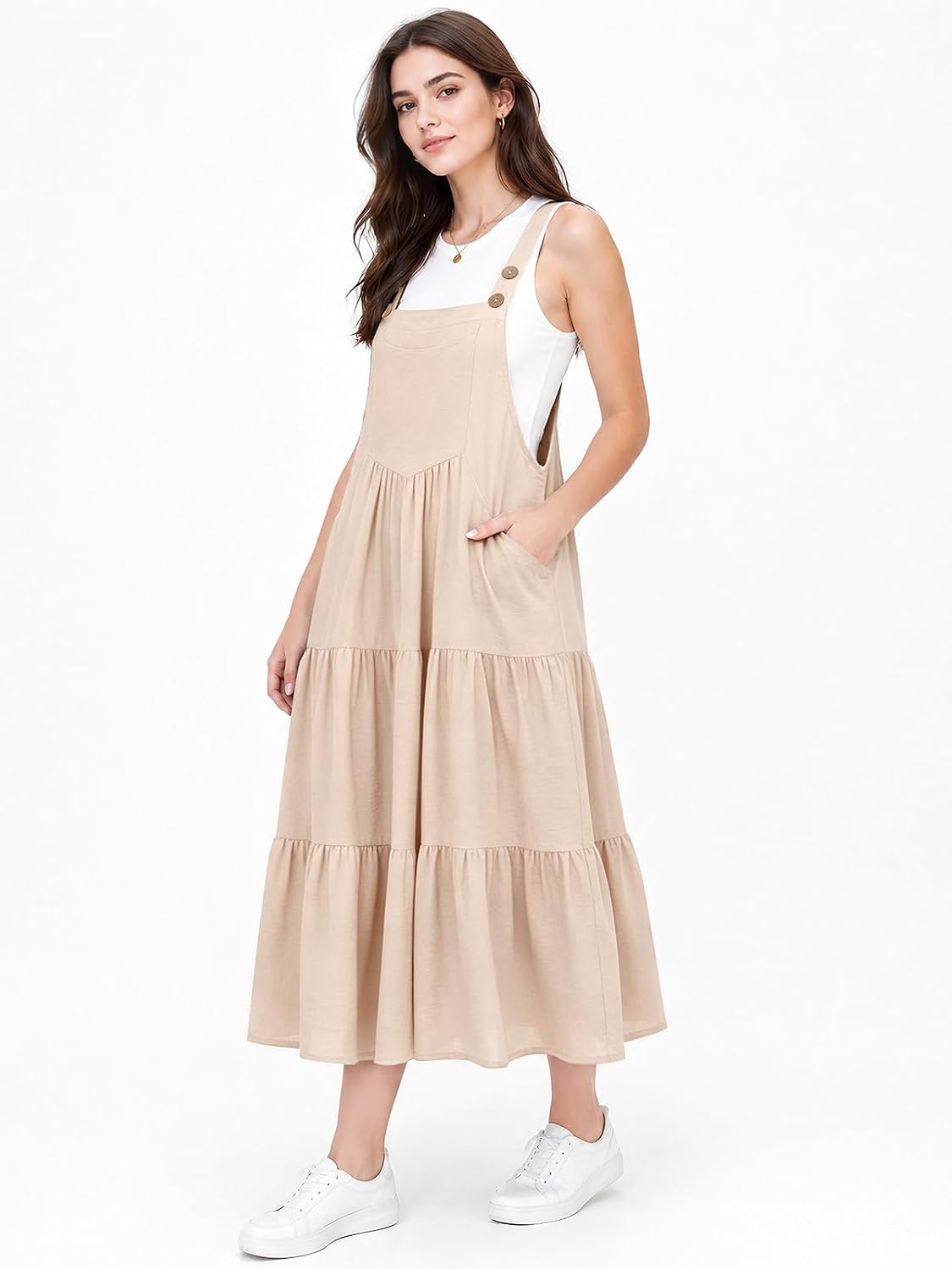 Beige sleeveless midi overall dress with button-strap detail and tiered skirt