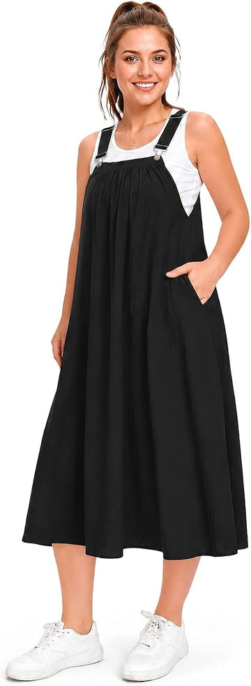 Black cotton overall dress with white-trim straps and wide, flowing mid-calf skirt
