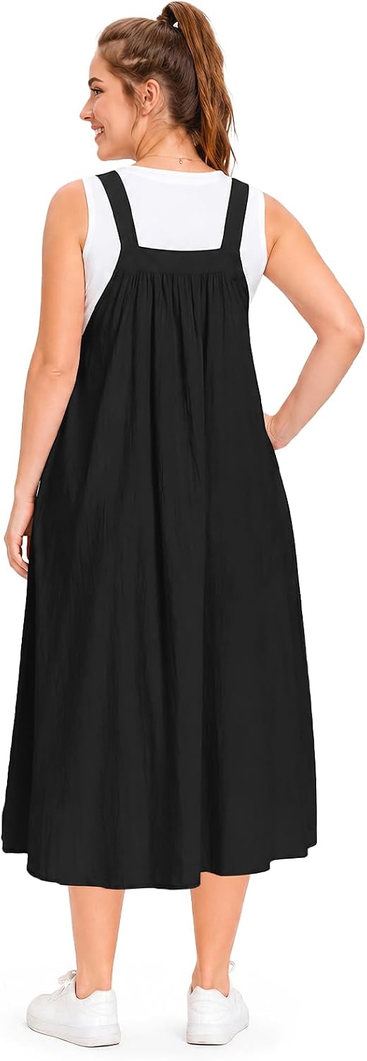 Back view of black cotton overall dress with square neckline and flared A-line skirt