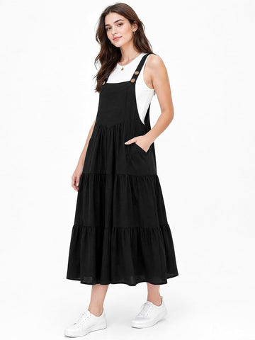 Black sleeveless tiered midi overall dress with adjustable straps and pockets