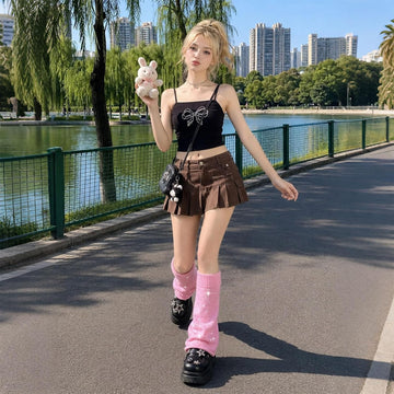 Pink rhinestone slouchy leg warmers worn with black shoes