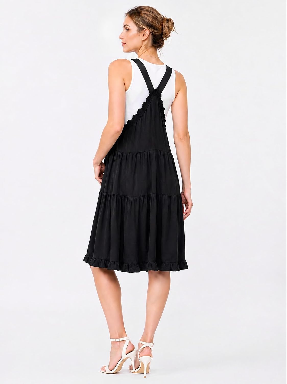 Black short overall dress with lace-trim bib, racerback straps, and tiered skirt