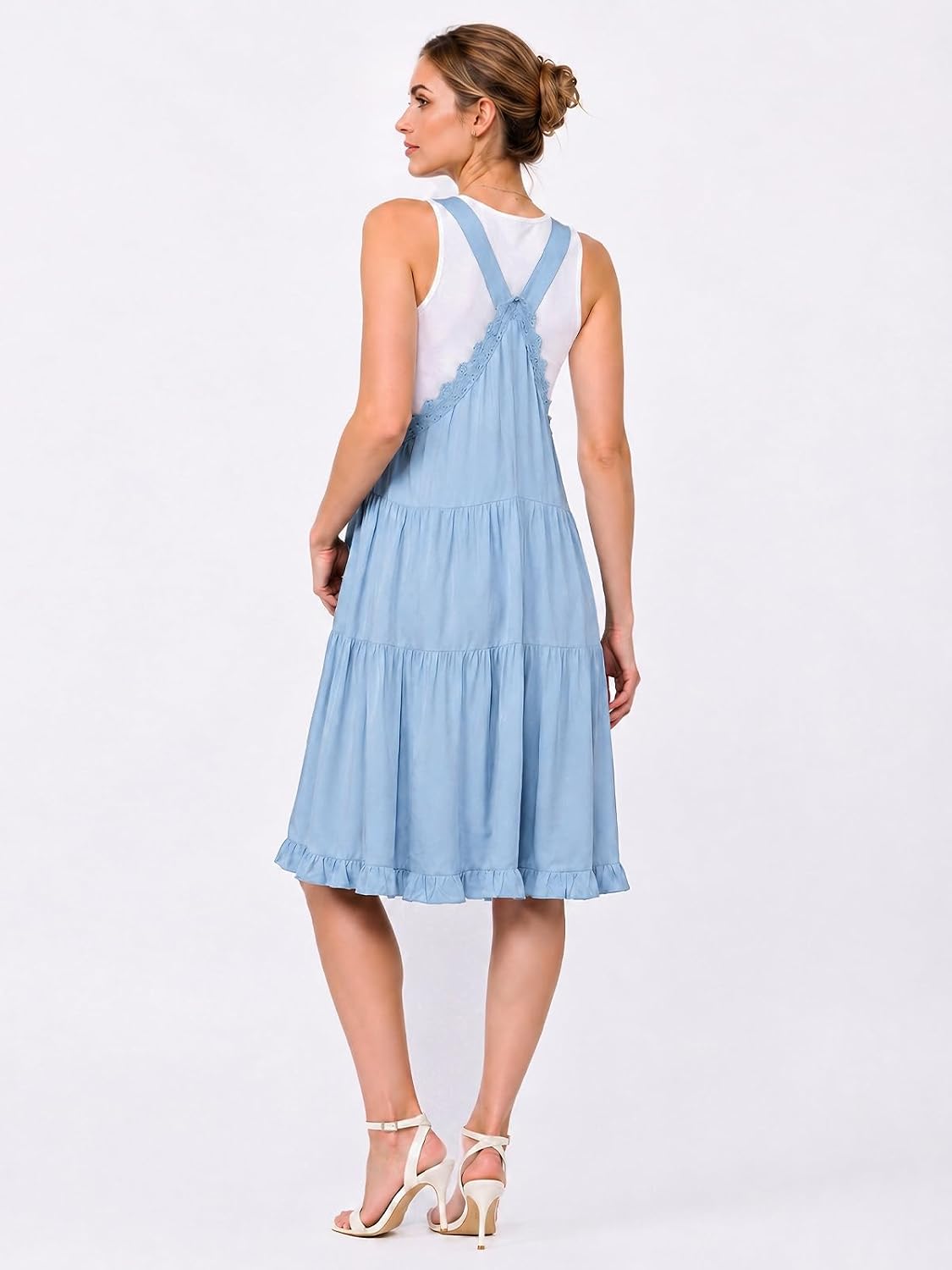 Moon Wood short overall dress with pockets, back view in light blue, tiered skirt