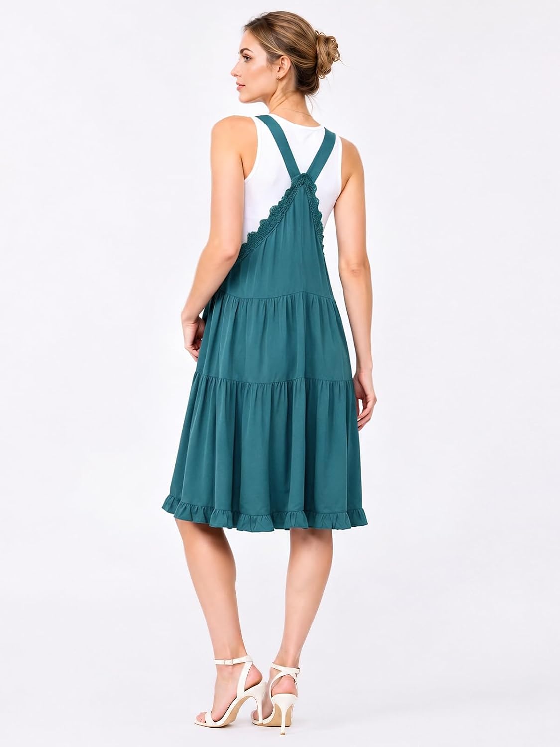 Teal-blue short overall dress from the back with adjustable cross straps