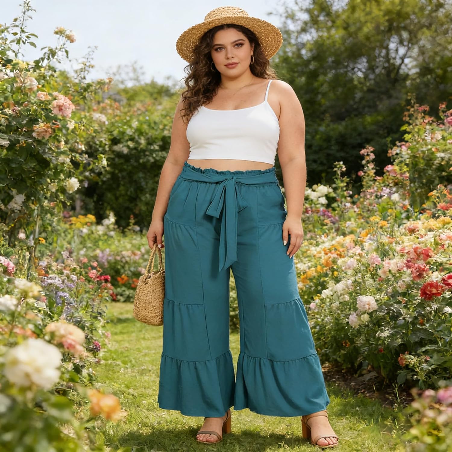 Turquoise plus-size palazzo pants with tie waist and flowing tiered wide legs