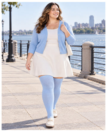 Plus size light blue ribbed knit thigh high stockings on a womens fashion model in an everyday lifestyle scene 1