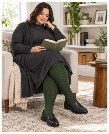 Plus size olive green ribbed knit thigh high stockings on a womens fashion model in an everyday lifestyle scene 2