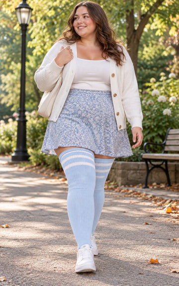 Plus Size Womens Thigh High Socks Baby Blue and White plus-size female model outdoor lifestyle scene; true thigh-high height and original striped knit texture preserved