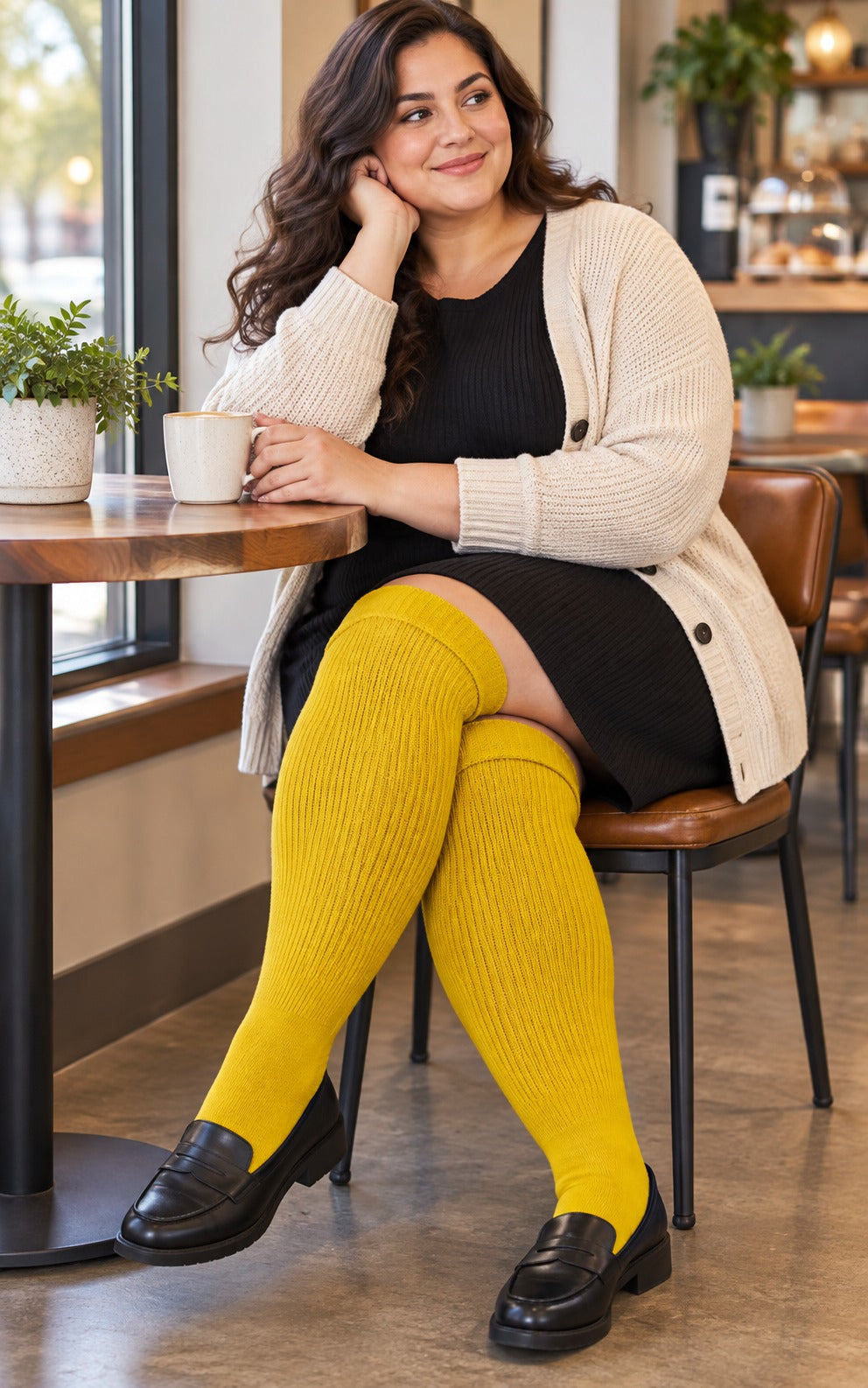 Women's plus size Mustard Yellow thigh high socks reaching the upper thigh in a lifestyle model scene 2