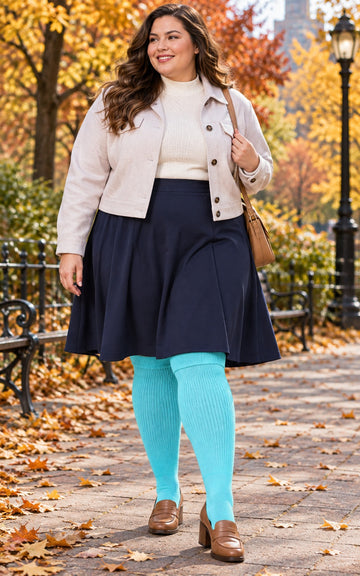 Women's plus size Pastel Blue thigh high socks reaching the upper thigh in a lifestyle model scene 1