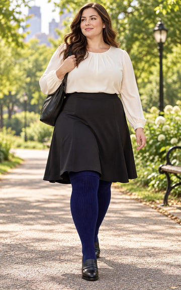 Women's plus size Smokey Navy thigh high socks reaching the upper thigh in a lifestyle model scene 1