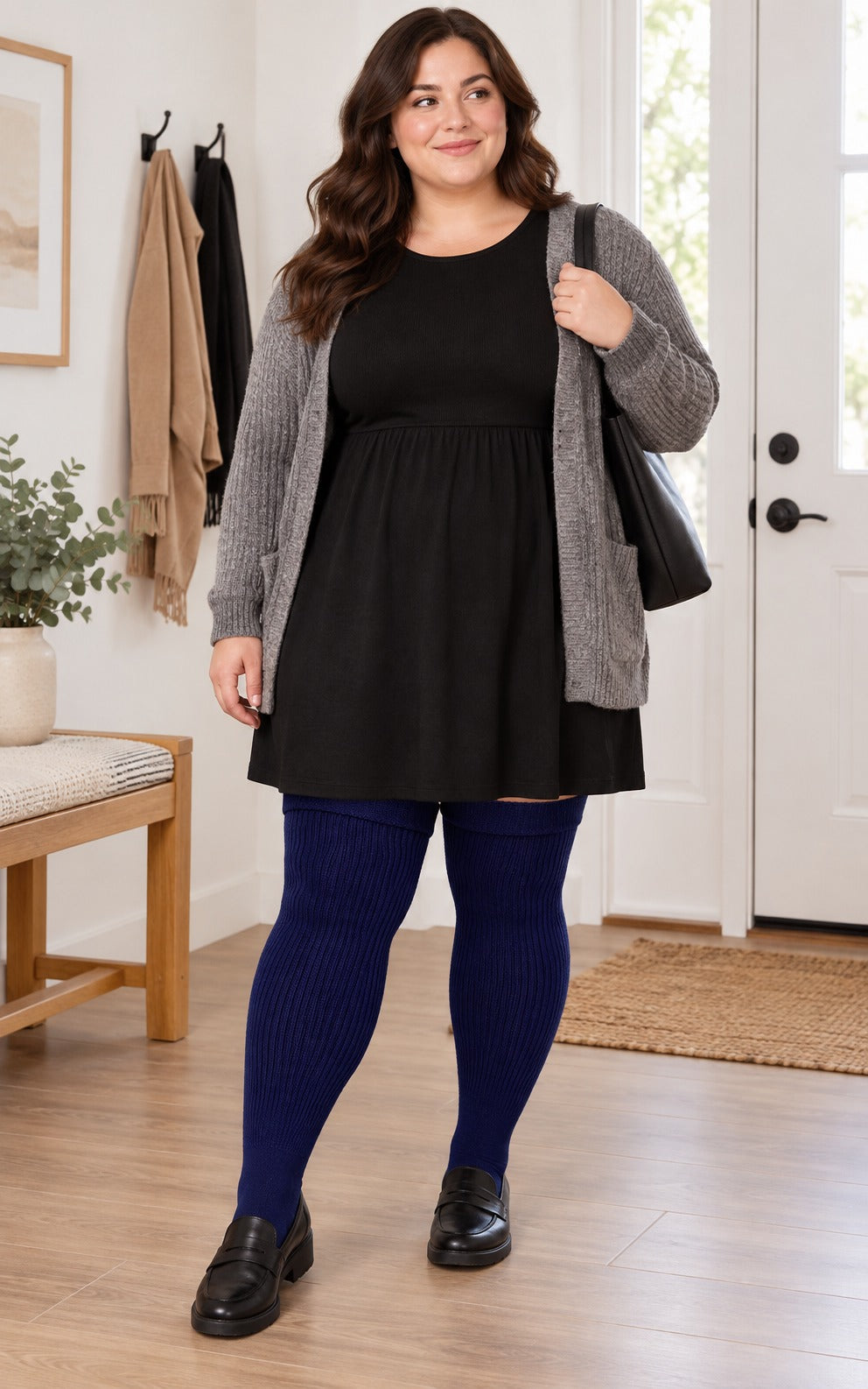 Women's plus size Smokey Navy thigh high socks reaching the upper thigh in a lifestyle model scene 2